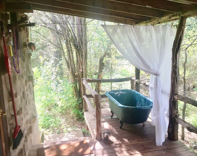 outdoor tub on cabin porch 