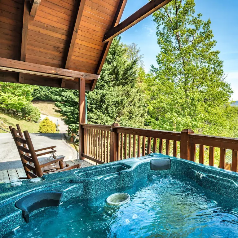 cabin with view from deck with hot tub